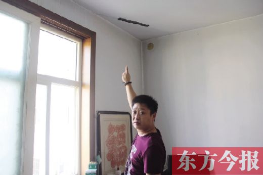 鶴壁一小區(qū)樓板斷裂數(shù)年無人管 律師稱開發(fā)商應(yīng)根據(jù)實際損失加以賠償(圖)