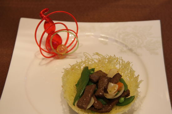 雀巢爆羊柳。 花惠生 供圖